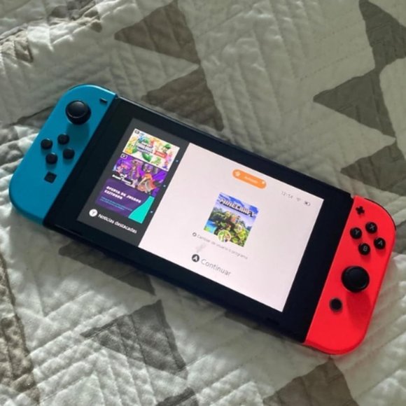 Nintendo Switch™ with Neon Blue and Neon Red Joy‑Con™ - Picture 2 of 7